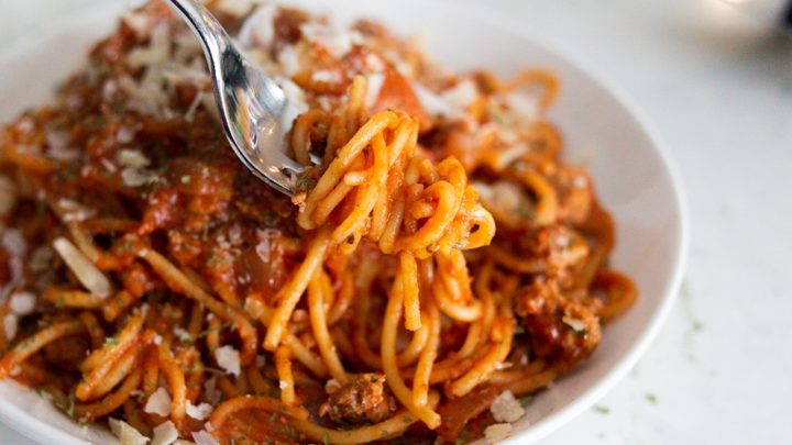 A bowl of one pan spaghetti with red meat sauce.